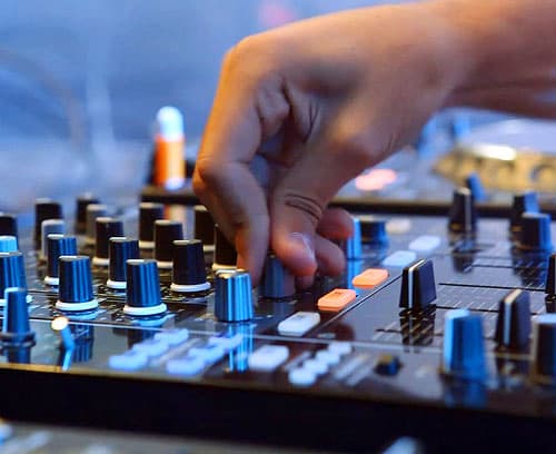 A man working on a soundboard.