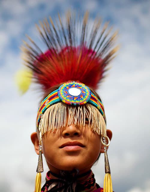 a young boy in Native American dress