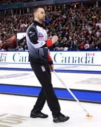 Canada skip Brad Gushue celebrates after scoring against Sweden in the 9th end during the gold medal game at the Men's World Curling.