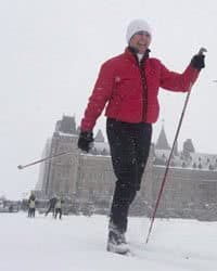 Senator Nancy Greene skies around the front lawn of the Parliament buildings during an event promoting the National Health and Fitness day in Ottawa.