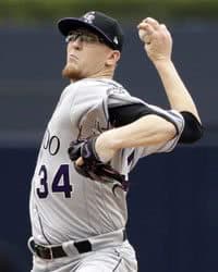 Baseball pitcher throwing.