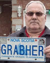 Lorne Grabher displays his personalized licence plate in Dartmouth, Nova Scotia.