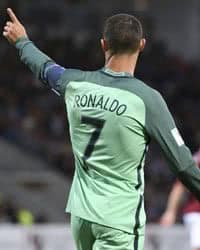 Portugal's Cristiano Ronaldo Holds up left hand after scoring during World Cup Group B qualifying match.