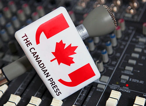 A microphone with The Canadian Press logo.