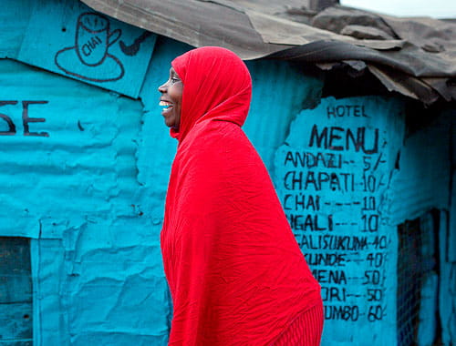 A woman wearing a red garb in Kenya.