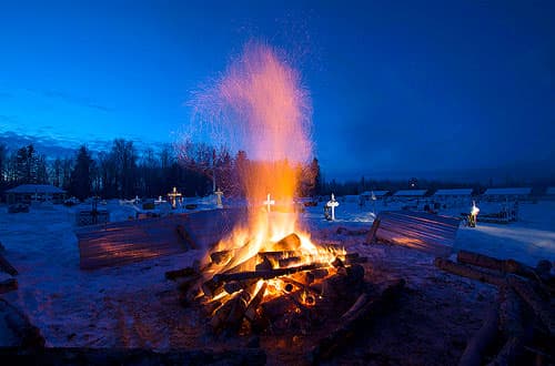 A fire burns to melt the ground so a grave can be dug at the cemetery in La Loche, Saskatchewan.