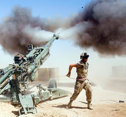 Gunner Jody Winsor, from Robert's Arm, Nfld., with the Canadian 2nd RCHA fires a 155mm howitzer