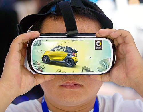 Young boy wearing virtual reality headset.