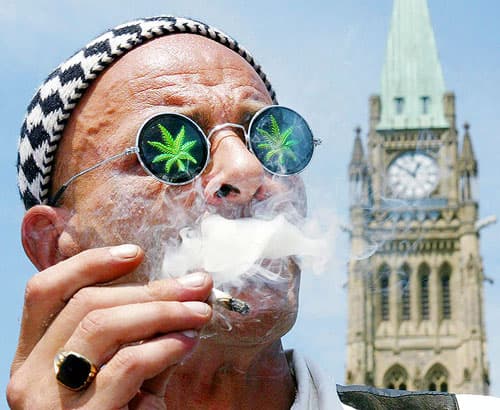 Don Appleby, a marijuana perscription holder, smokes a joint on Parliament Hill, in Ottawa