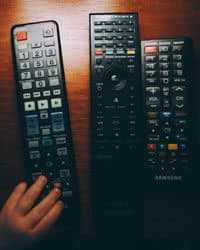 Three remote television remote control devices.