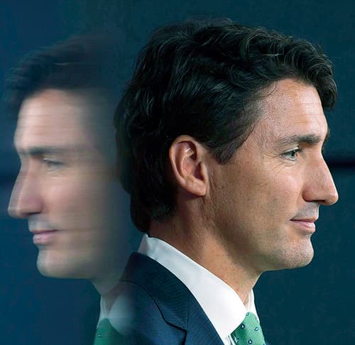 Profile picture of Justin Trudeau with a mirror reflection behind him.