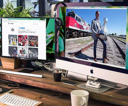 A CFL train tour photo and instagram page on two desktop monitors