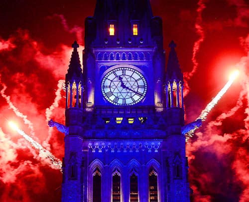 Fireworks display behind Parliament building.