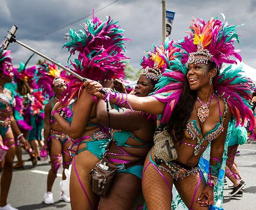 Parade participants taking a selfie during the Grand Parade at the Caribbean Carnival in Toronto.