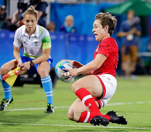 Canada's Ghislaine Landry scores a winning try during the women's rugby sevens quarter final match against France