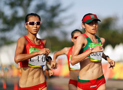 Mexico's Maria Guadalupe "Lupita" Gonzalez, right, competes in the women's 20-km race walk