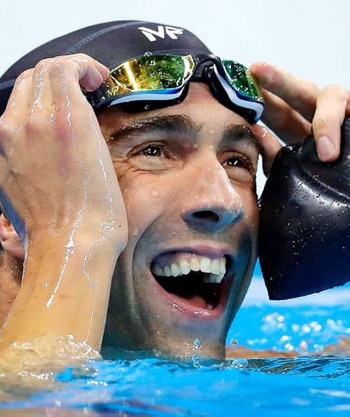 United States' swimmer Michael Phelps reacts after the men's 100-meter butterfly final
