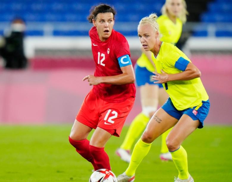 Canada's Christine Sinclair dribbles the ball in front of Sweden's Caroline Seger in the women's soccer final during the summer Tokyo Olympics in Yokohama, Japan on Friday, August 6, 2021. THE CANADIAN PRESS/Frank Gunn
