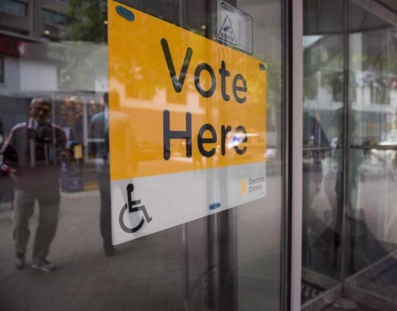 An Elections Ontario sign is seen at University - Rosedale voting location at the Toronto Reference Library on Thursday, June 7, 2018. Advance voting locations open today across Ontario as party leaders fan out across the province to pitch voters on their platforms.THE CANADIAN PRESS/Marta Iwanek