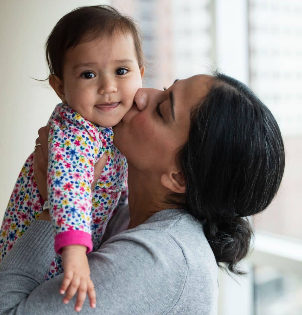 Bushra Saeed-Khan holds her 11-month-old daughter